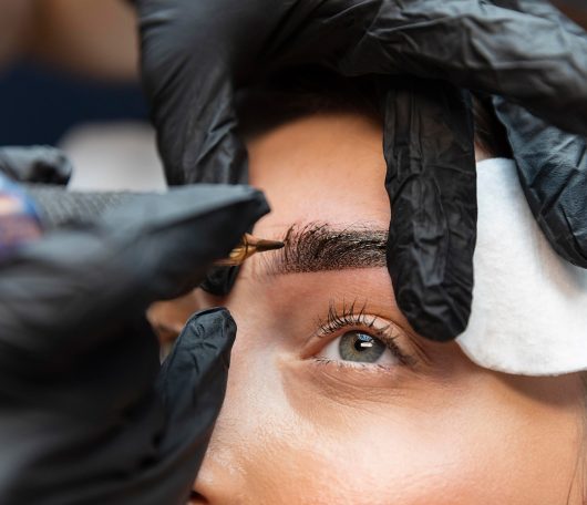 young-woman-getting-beauty-treatment-her-eyebrows